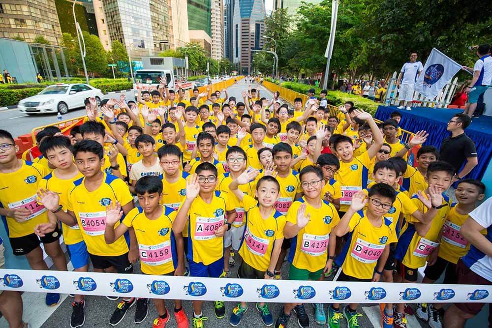 A crowd of kids preparing for the POSB Passion Run