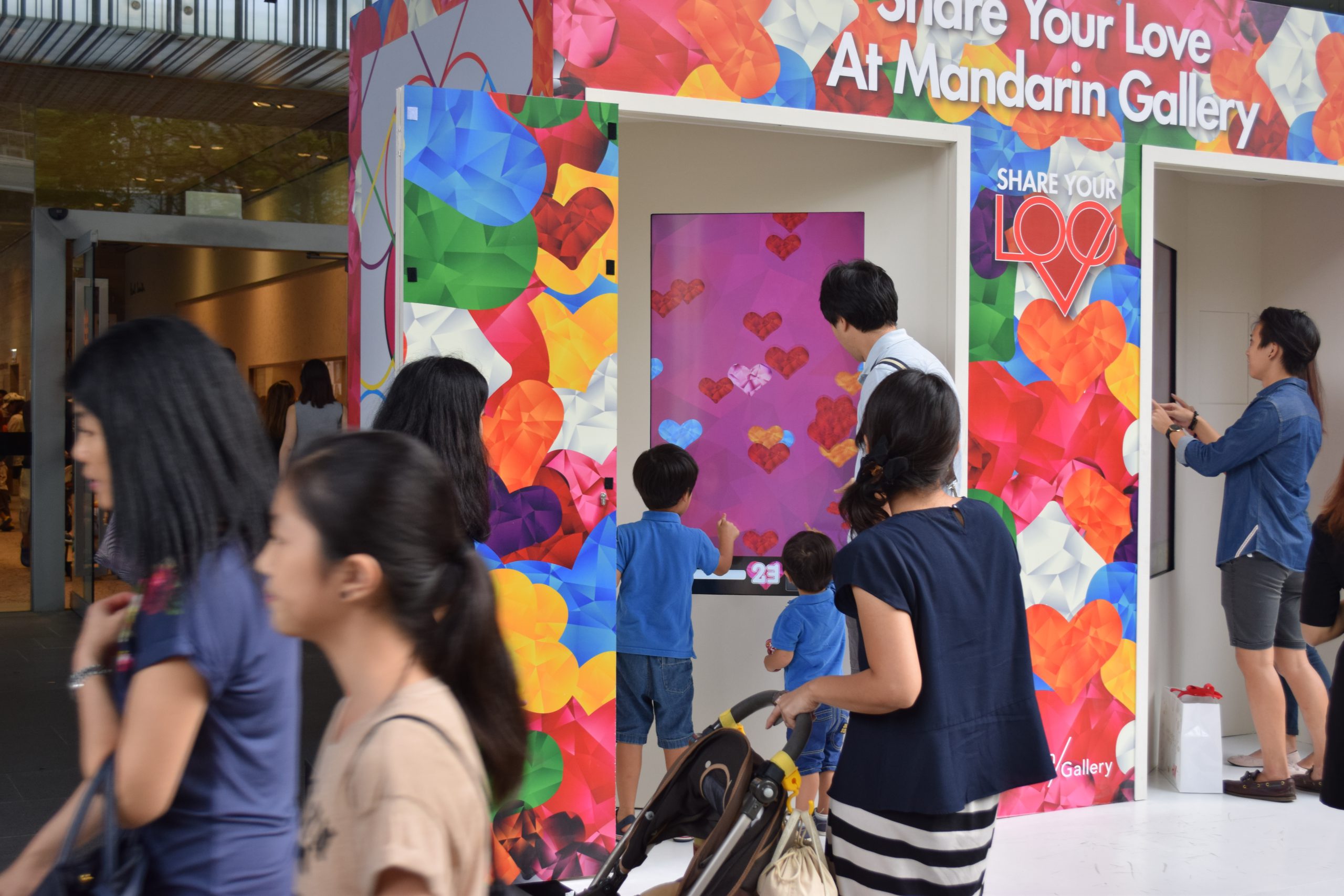 People playing the share your love social game outside mandarin gallery