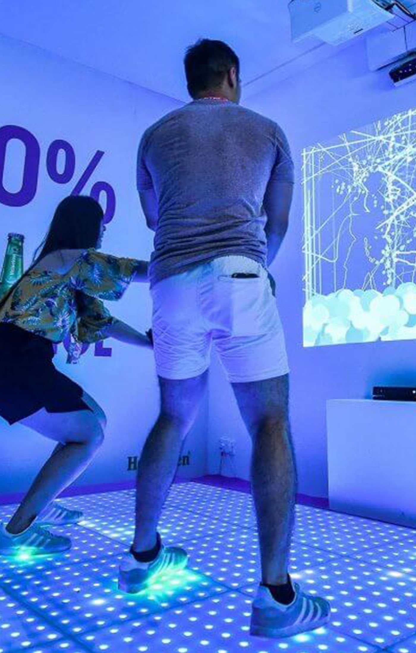 A couple participating in the Heineken 0.0 Interactive Dance Studio