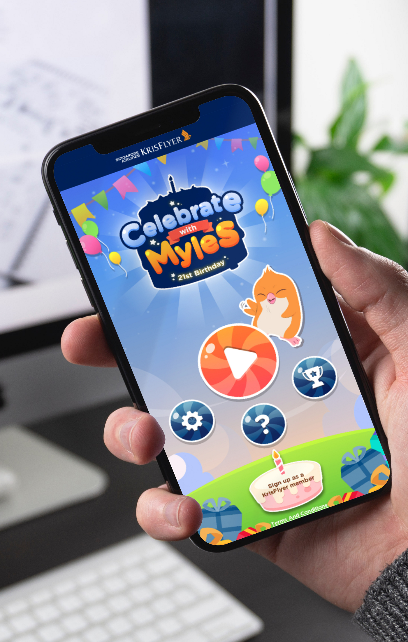 A man in grey sweater is ready to play the celebrate with myles microsite game